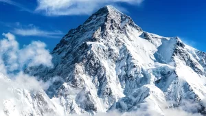 Immensely tall and jagged mountain covered in snow