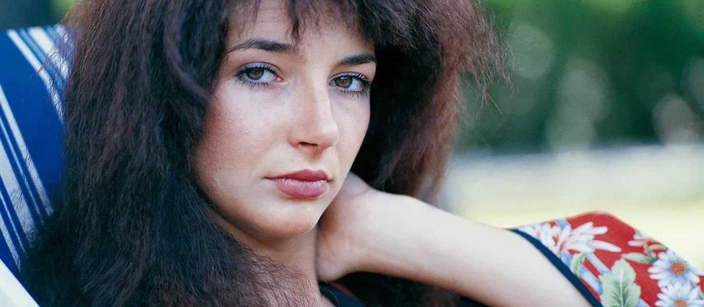 Close up of a young Kate Bush leisurely looking into the camera