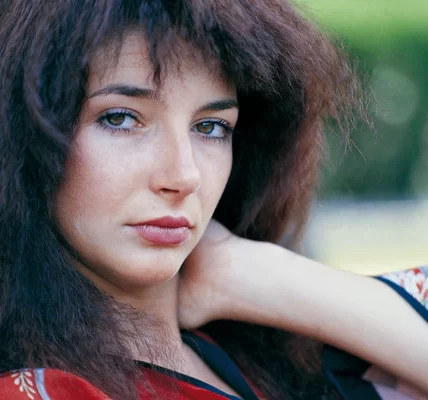 Close up of a young Kate Bush leisurely looking into the camera