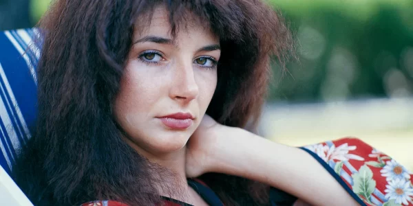 Close up of a young Kate Bush leisurely looking into the camera